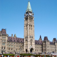 Tourists in front of the Parliament during Ottawa&#039;s annual Tulip Festival